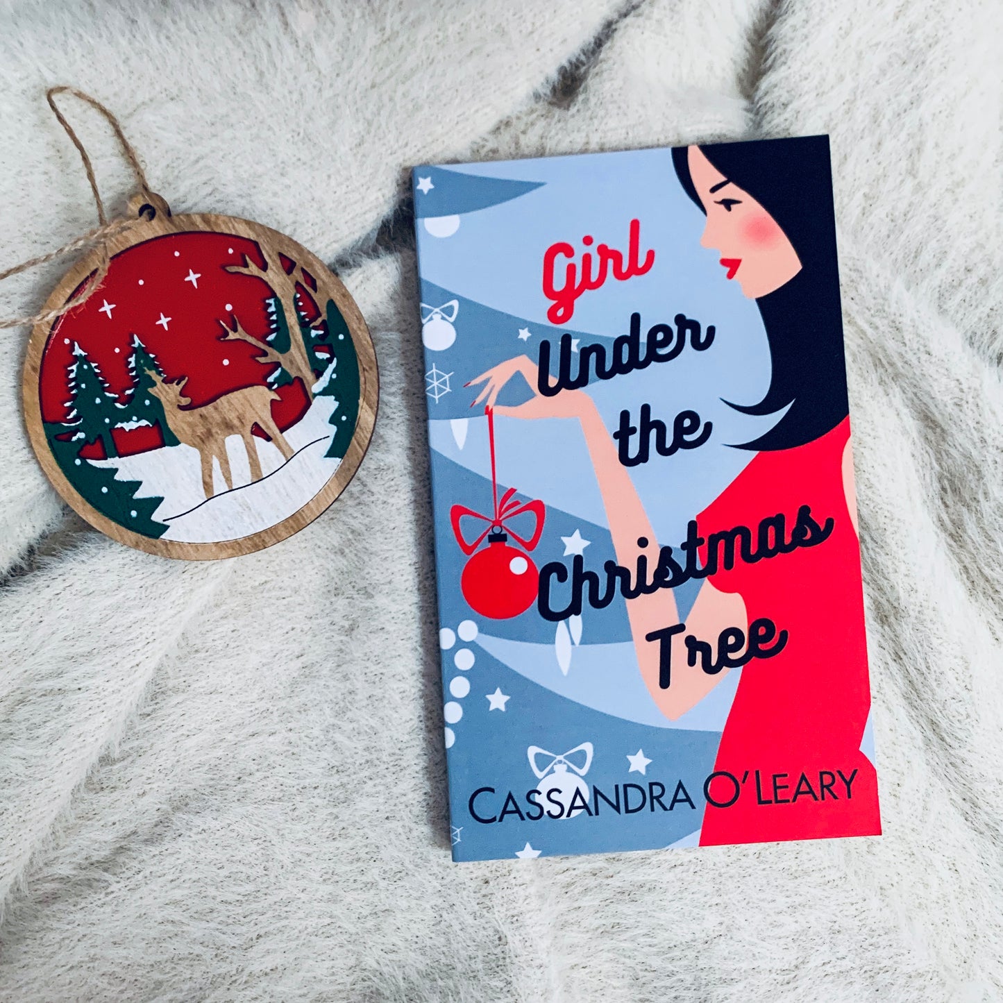 Girl Under the Christmas Tree by Cassandra O’Leary