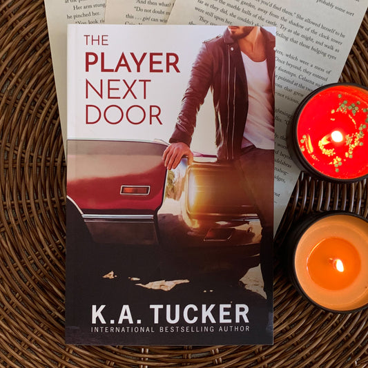 The Player Next Door by K. A. Tucker